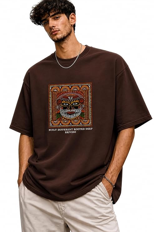 BRIVIDO Men’s 240 GSM Oversized Graphic T Shirt | Premium Cotton Relaxed Fit Drop Shoulder Streetwear| Theyyam Tribal Art Kerala Heritage Indian Culture Artistic Fashion Rooted Deep Graphic Tee